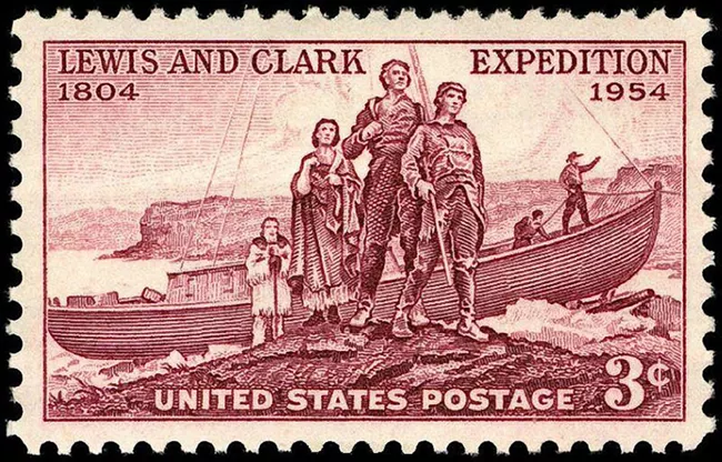 U.S. postage 3¢ stamp depicting red ink illustration of  Lewis & Clark with Sacagewa in foreground and canoe and Missouri River in background,   