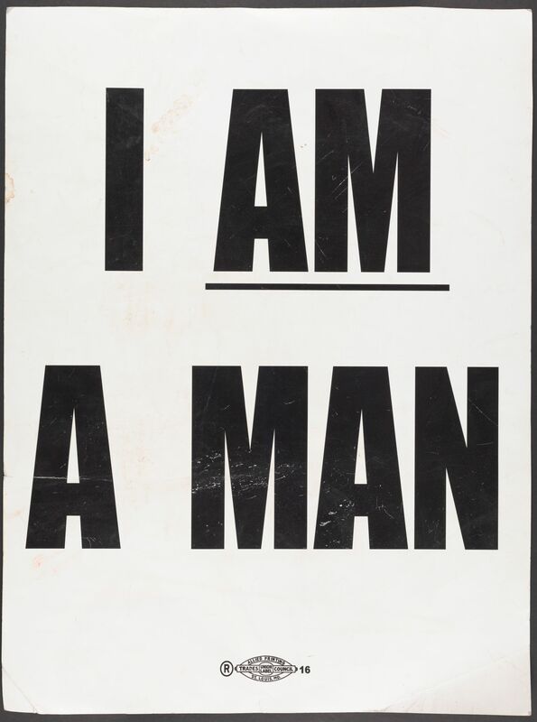 An all-caps typed poster reading "I AM A MAN" with "am" underlined. The poster is slightly smudged
and wrinkled.