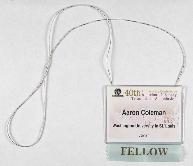  A nametag for the "American Literary Translators Association" including among other details a ribbon noting fellowship. 