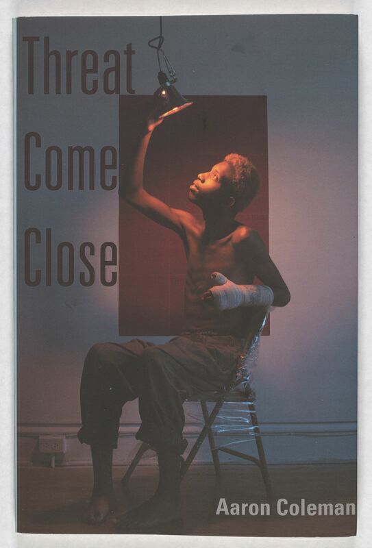 The covert art for Threat Come Close features a young Black man with a cast on his left arm seated in a metal folding chair reaching up to angle a heat lamp towards his upturned face. The lighting is dark, and he is cast partly in shadows. The title of the book Threat Come Close is in black all caps, and Coleman's name is listed in the bottom in white text.